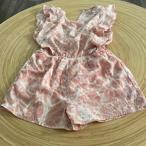 Pink and white romper.